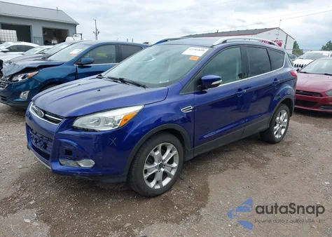 2016 Ford Escape Titanium z USA, uszkodzony, nr VIN 1FMCU9J92GUC83535